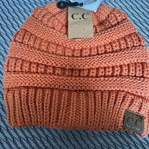 C.C Orange Chunky Knit Beanie Hat with criss cross back for your pony tale…